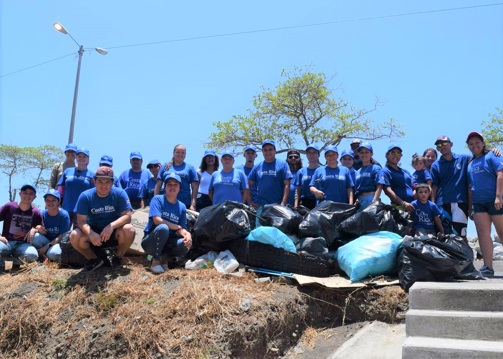 “A group of librarians and community members with garbage bags removed from the beach in Caldera ” by COPROBI is licensed under CC BY 4.0